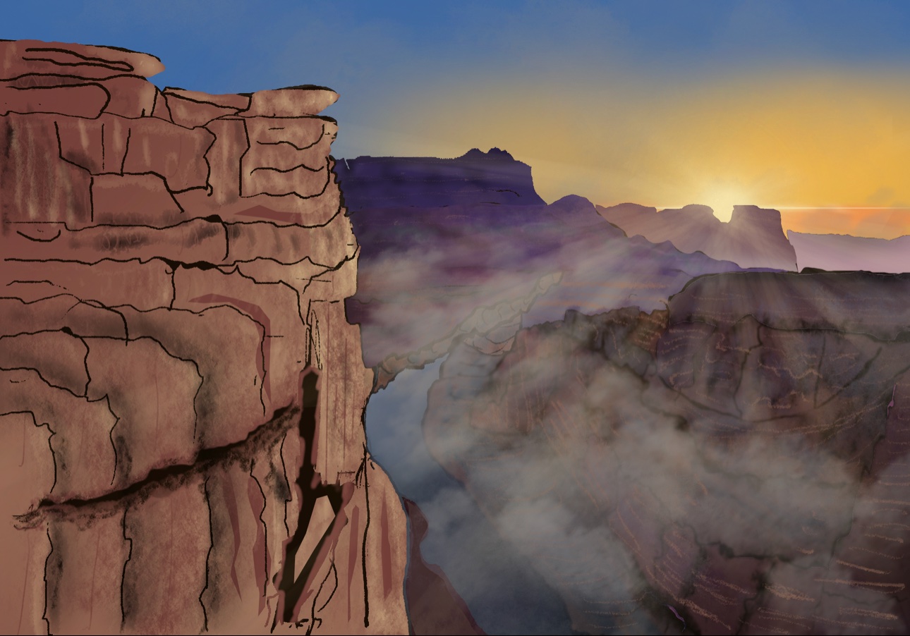 A desert canyon landscape at sunset